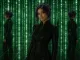 Seraphine standing in a green Matrix-like construct in a sleek black outfit.